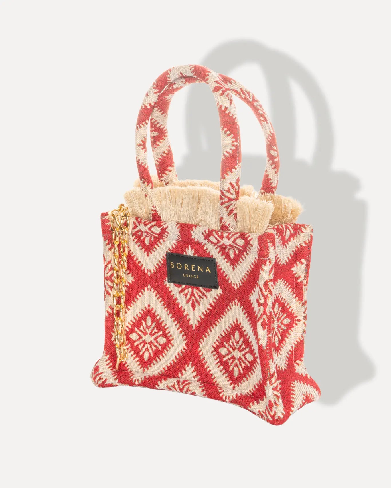 Linke Seite Kalokairaki Mini Tote Bag Sorena Greece, kompakt rotes Jacquard Muster auf Ivory, kleiner Shopper handgefertigt