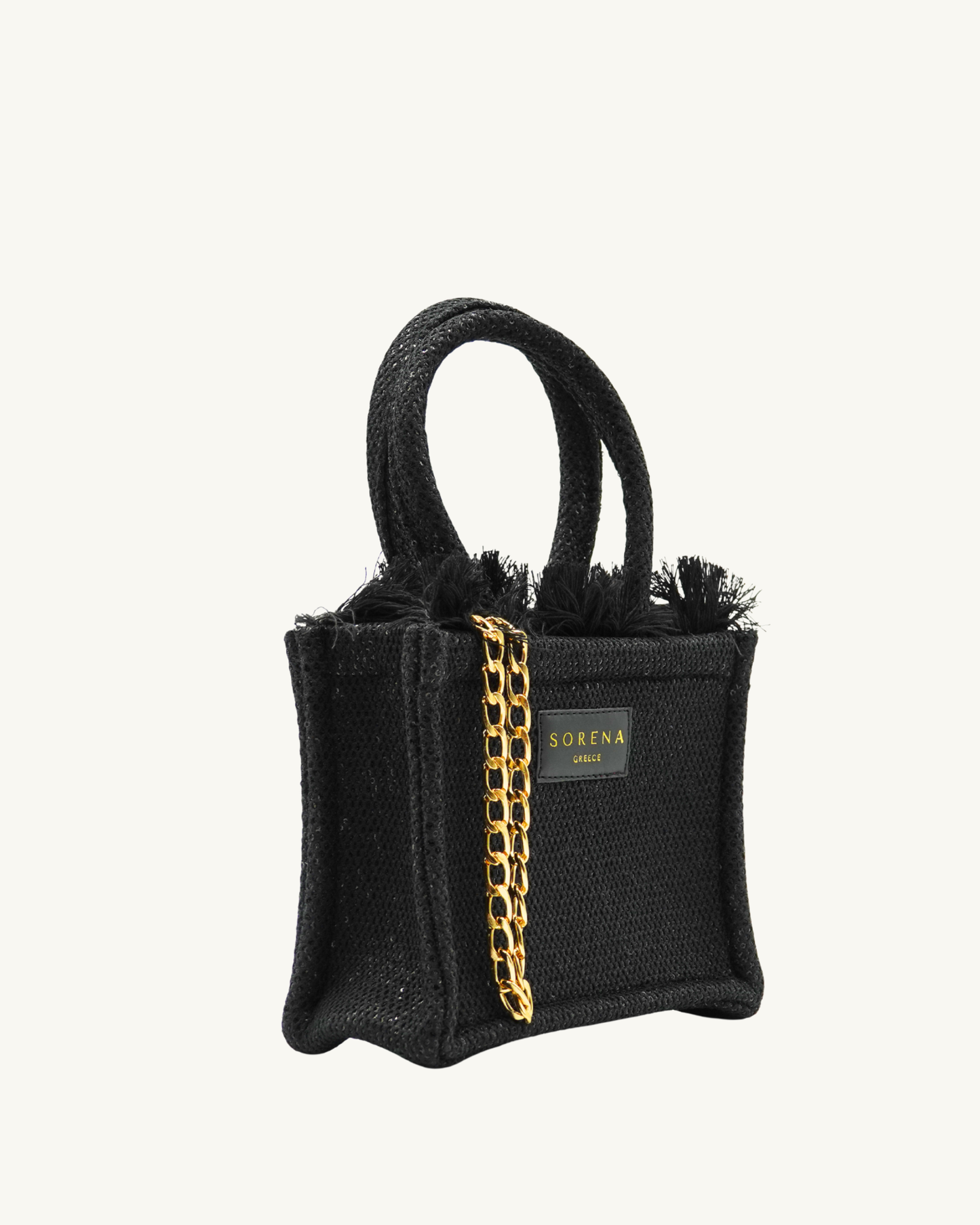 Rechte Seitenansicht der SORENA Mini-Tasche ADORA mit goldenen Pailletten auf schwarzem Grund – handgemacht und nachhaltig kuratiert von SIMORA