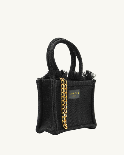 Rechte Seitenansicht der SORENA Mini-Tasche ADORA mit goldenen Pailletten auf schwarzem Grund – handgemacht und nachhaltig kuratiert von SIMORA