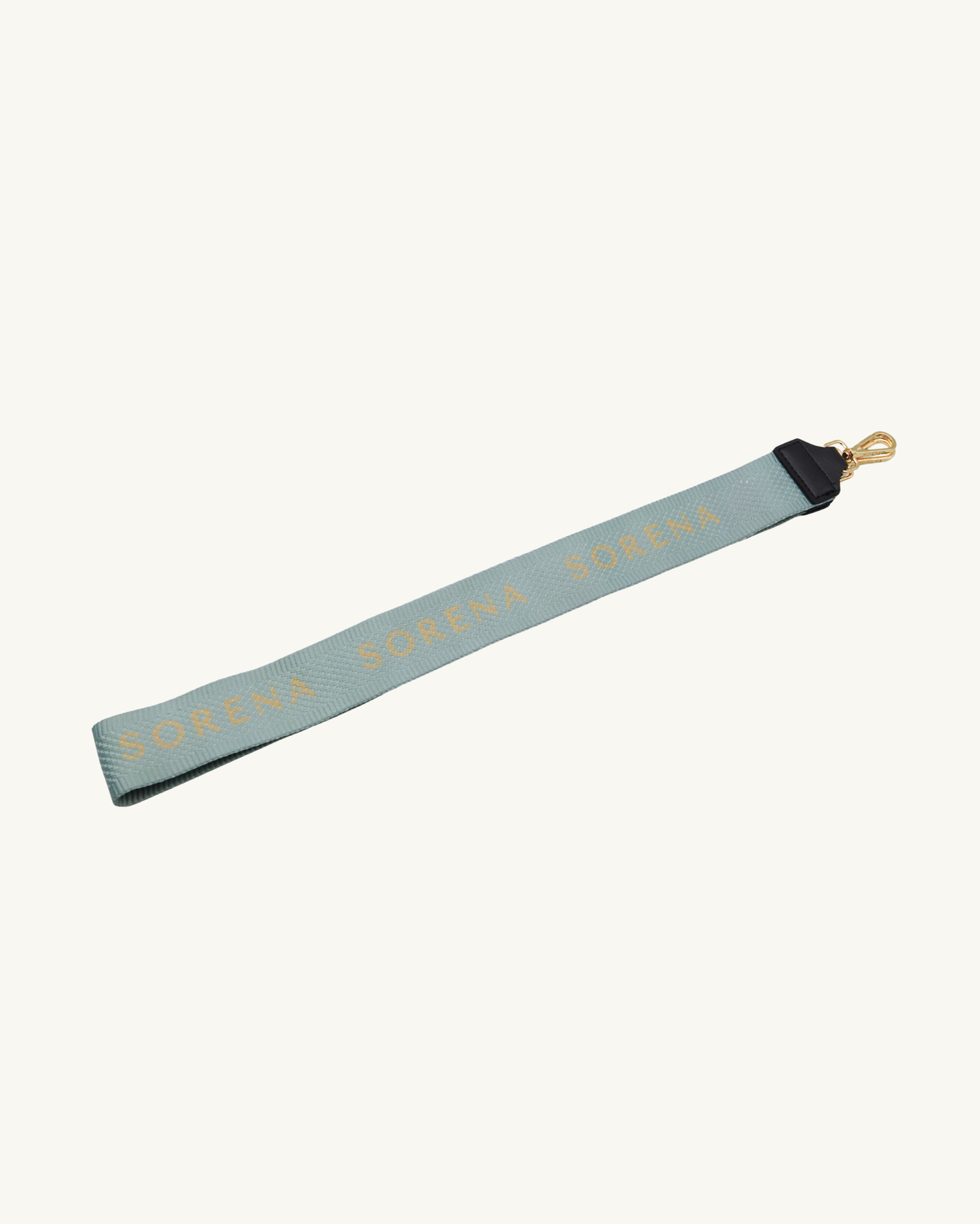 Beiger SORENA-Gurt mit weißem Schriftzug – elegantes Accessoire zur CRYSTALIA Shopper mit Kristallmuster