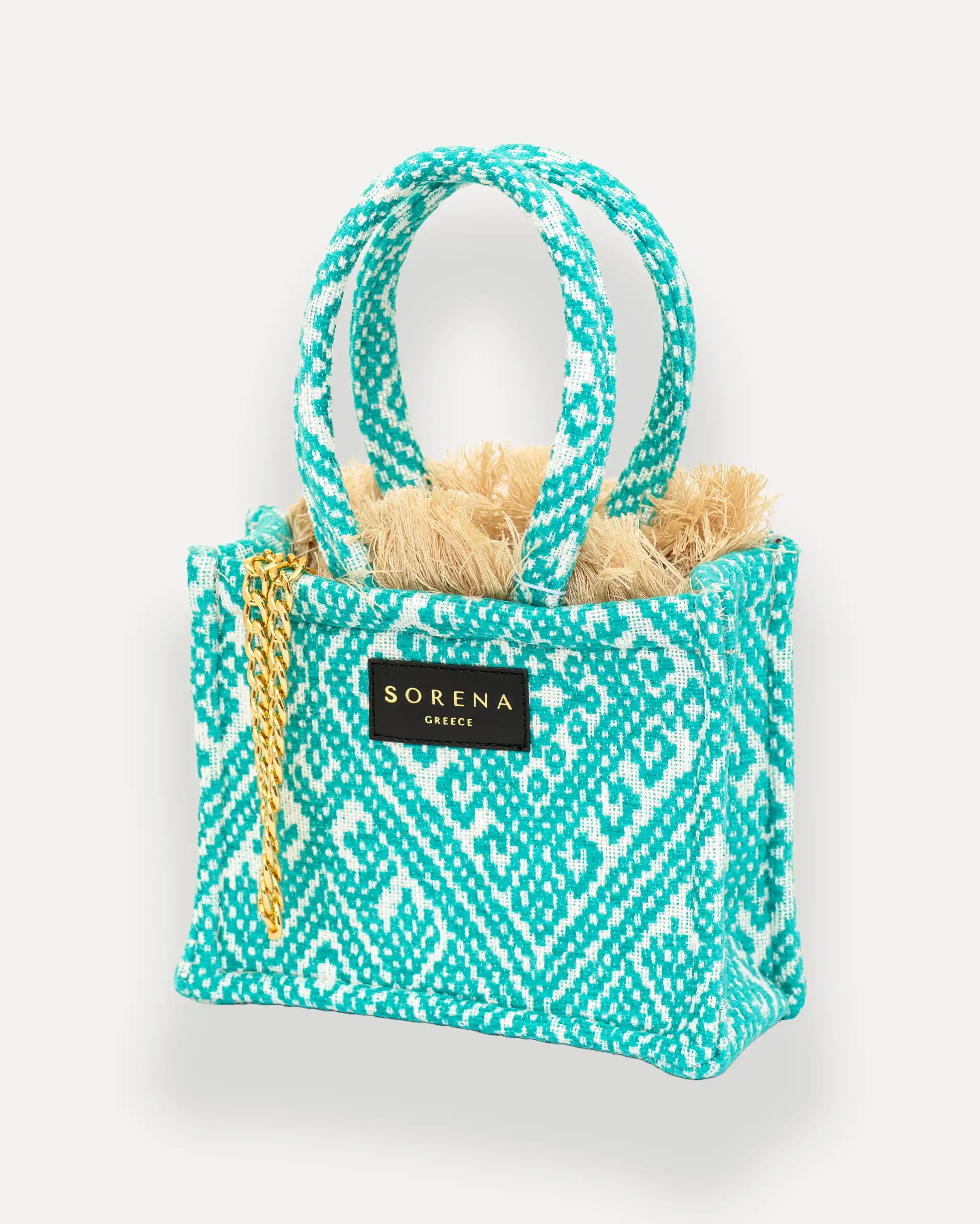 Sorena Greece Mini Tote Bag linksseitig getragen – kleine handtasche mit goldener Kette, ideal als mini bag für City-Looks, bags schweiz mit Statement-Charakter.