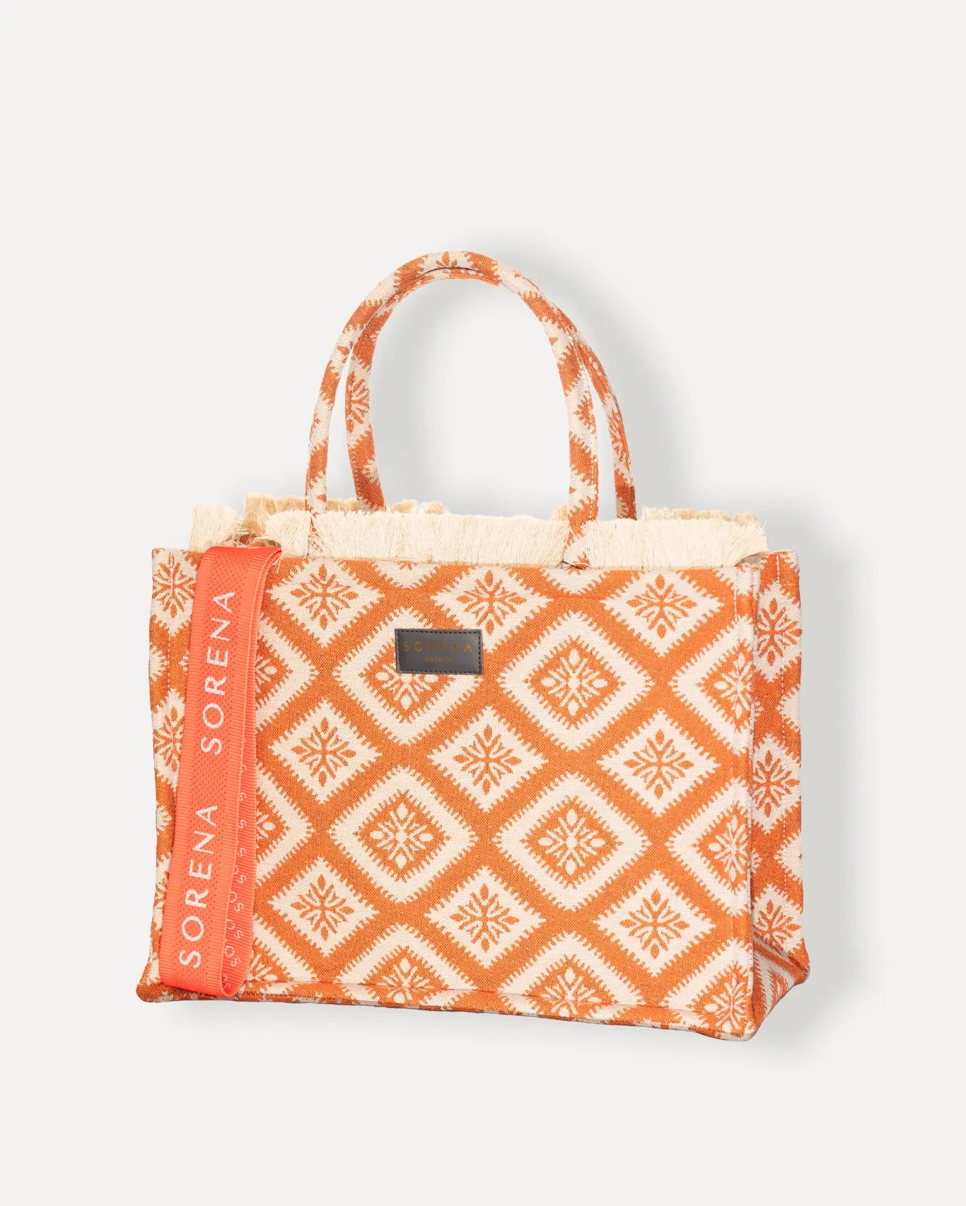 Linke Seite Kasteli Large Tote Bag Sorena Greece, leuchtendes Tangerine Orange auf Ivory Jacquard Hintergrund, breite Griffe strukturiertes Gewebe