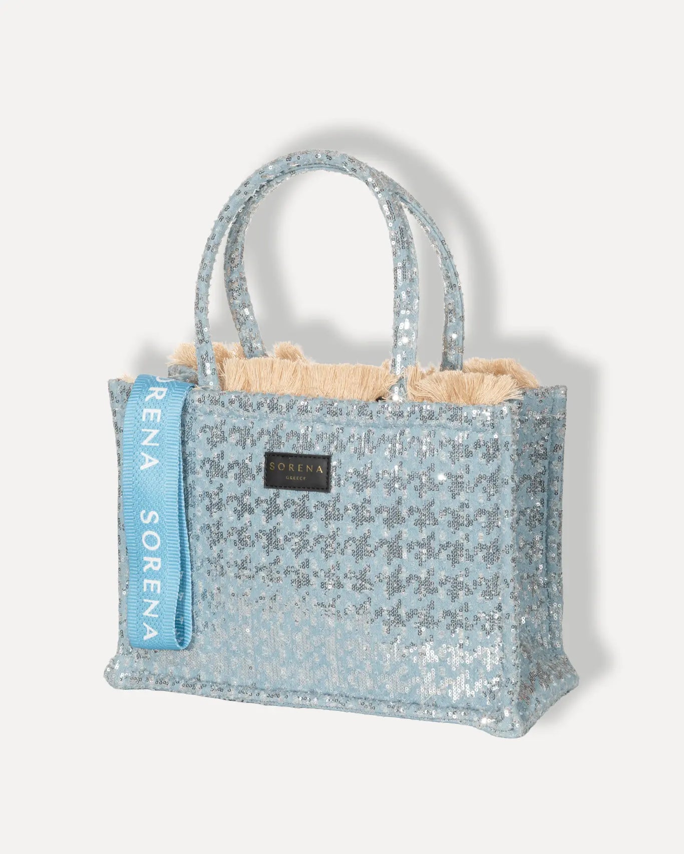 Linke Seite Tritiani Medium Tote Bag Sorena Greece, vollflächige Micro Pailletten Silber irisierend Lichtspiel breite Griffe handgefertigt.