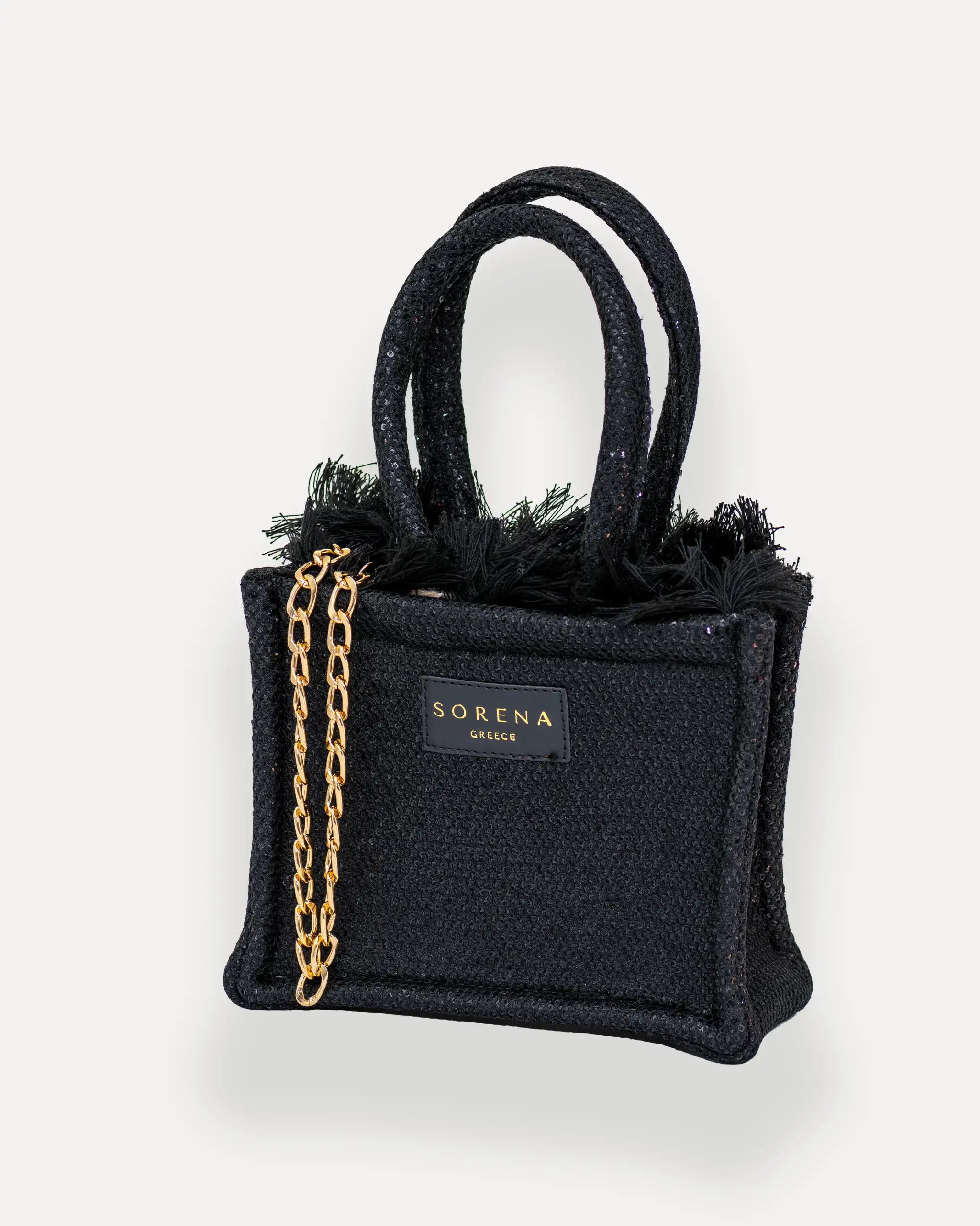 Sorena Greece Mini Tote Bag linksseitig getragen – kleine handtasche mit goldener Kette und funkelnder Textur, ideal als mini bag für Damen, limitierte designer bags schweiz für City-Looks.